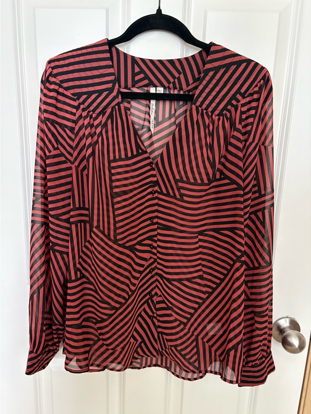 Bellatrix Coral and Black Striped V-Neck Geometric Blouse